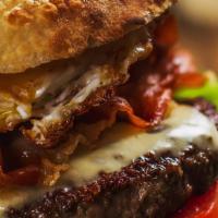 Il Tutto Burger · 8 oz. Kobe beef, lettuce, tomato, prosciutto, sunny side-up egg, American cheese, thousand i...