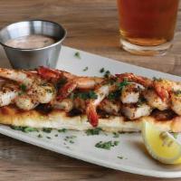 Char-Grilled Shrimp · Boldly marinated shrimp char-grilled & served on grilled garlic bread with house-made remoul...