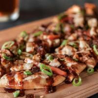 Chipotle Bbq Chicken Flatbread · Tender, grilled chicken with onions, peppers & bacon smothered in mozzarella cheese. Finishe...