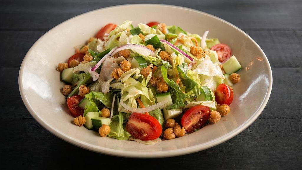 House Salad · Mixed Greens, grape tomatoes, shredded carrots, cucumbers & red onions, tossed in our house dressing. Topped with crispy garbanzo beans