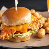 Crispy Buffalo Chicken Sandwich · Lightly hand-breaded beer-brined chicken breast tossed in spicy buffalo sauce & topped with ...