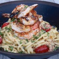 Shrimp Linguine · Blackened shrimp served atop linguine, tossed in a house-made scampi sauce with roasted grap...