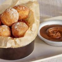 Nutella® “Churro” Donuts · Fresh fried donuts tossed in cinnamon sugar & served with a side of NUTELLA®.