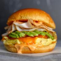 Smoked Turkey, Egg, And Avocado Brioche Sandwich · 2 fresh cracked cage-free scrambled eggs, melted Cheddar cheese, smokey turkey, avocado, and...