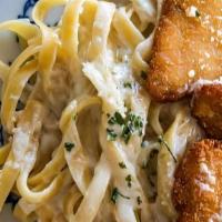 Fettuccine Alfredo · Made-to-Order Alfredo Sauce Tossed with Imported Fettuccine and Topped with Fried or Baked C...