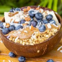 Almond Acai Bowl · Granola, banana, blueberries, almond Flakes and almond Butter on top.