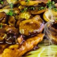 Chicken Marsala · Sauteed chicken breast with fresh mushrooms flambeed in a sweet Marsala wine sauce served ov...