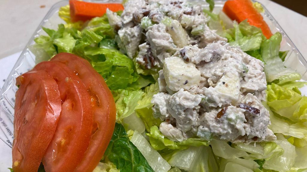 Chicken Salad Plate · Romaine lettuce, chicken salad, tomatoes, & carrot sticks.

Our chicken salad contains chunky white meat chicken made with apples pecans, a sprinkle of diced celery, spices and mayo.
