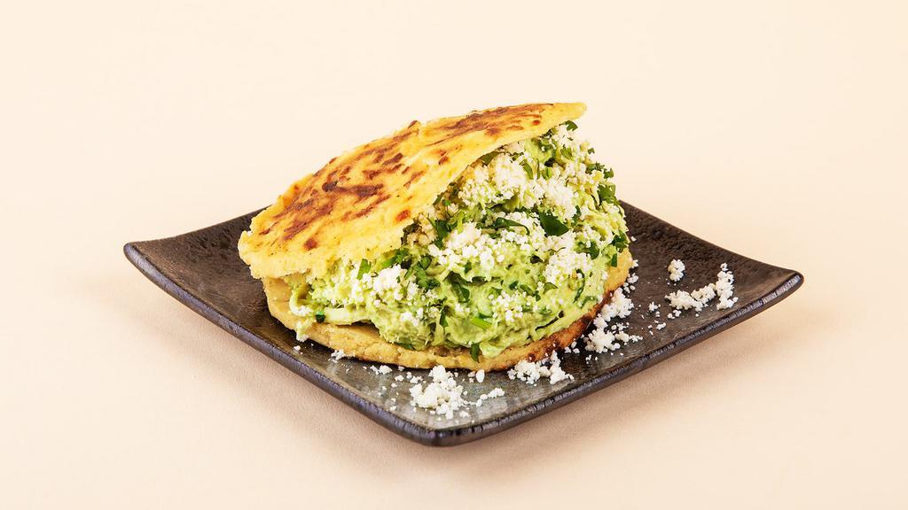 Avo Mayo Arepa · Your choice of protein with crumbled cotija cheese, sliced avocado, lettuce, mayo, and cilantro between two warm, fresh arepas.