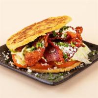 Blt Arepa · Bacon, lettuce, tomato, and crumbled cotija cheese between two warm, fresh arepas.