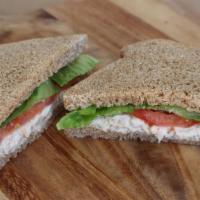 Tuna Salad Sandwich · Chunk tuna mixed in a homemade herbed mayo dressing. Served cold with fresh romaine, tomato,...