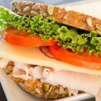 Turkey & Cheese Sandwich · Lightly smoked turkey breast and Swiss Cheese. Served cold with fresh romaine lettuce, tomat...