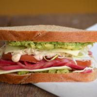 Baja Veggie Sandwich · Avocado, shaved cabbage, pickled red onions, tomato, and pepper jack cheese with a chipotle ...