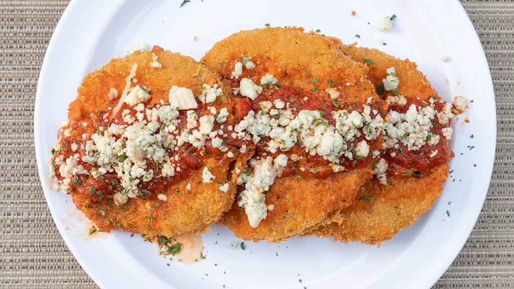 Fried Green Tomatoes · Sliced and dredged in seasoned panko, fried crispy; topped with Bleu cheese crumbles and our signature roasted red pepper coulis sauce.