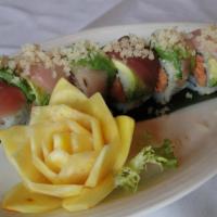 Tokyo Roll · Spicy tuna and avocado inside topped with tuna, yellowtail, avocado slices and tempura flake...