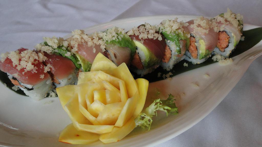 Tokyo Roll · Spicy tuna and avocado inside topped with tuna, yellowtail, avocado slices and tempura flakes. Raw.