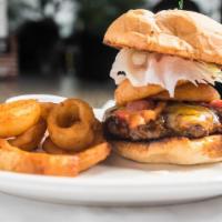 Western Burger · A half pound of fresh seasoned ground beef topped with cheddar cheese, bacon, onion rings, a...