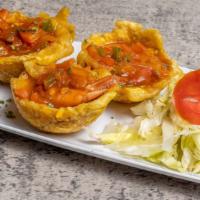 Mofonguitos (3) · Green plantain or cassava. Three delicious plantain or cassava cups filled with shredded che...