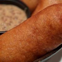 Mini Angus Beef Corndogs · Hand-battered and served with dark beer mustard.