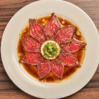 Tuna Tataki · Thinly sliced seared tuna in ponzu sauce and sesame oil.