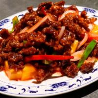 Sweet And Sour Beef · Flash-fried beef with onion, mixed peppers, pineapple and sweet and sour sauce