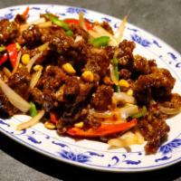 Kung Pao Beef · Flash -fried bef with  mixed peppers, onions, toasted peanuts and spicy sauce