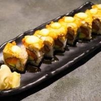 Aventura Roll · Salmon avocado roll topped with white fish tempura, drizzled with eel sauce and dotted with ...