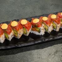 Fashion Roll · Salmon, cucumber, and avocado topped with spicy tuna, cilantro, jalapeño, and drizzled with ...