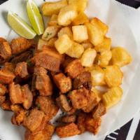 Fried Torresmo / Torresmo Frito · Fried pork belly and fried yuca.