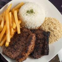 Picanha · Two grilled picanha steaks served with salad, rice, beans and french fries.

Dois pedaços de...