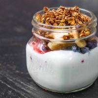 Yogurt Granola Bowl · 2% vanilla yogurt filled with berries bananas and homemade granola drizzle with honey.