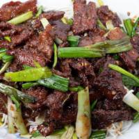 Mongolian Beef · Favorite. Sliced tender beef with green onion and garnished with rice noodles.