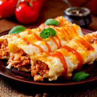 Baked Cannelloni · Fresh baked cannelloni mixed with choice of either cheese, meat, or spinach. Served with two...