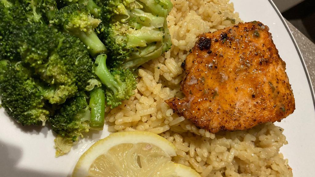 Salmon Dinner · Zesty Garlic Salmon topped with Garlic Lemon Butter Sauce, Butter Rice, and Steamed Garlic Broccoli