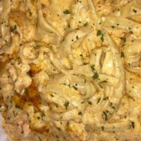 Surf & Turf Pasta · Homemade Baked Pasta made with a creamy cheese sauce, salmon, and shrimp.