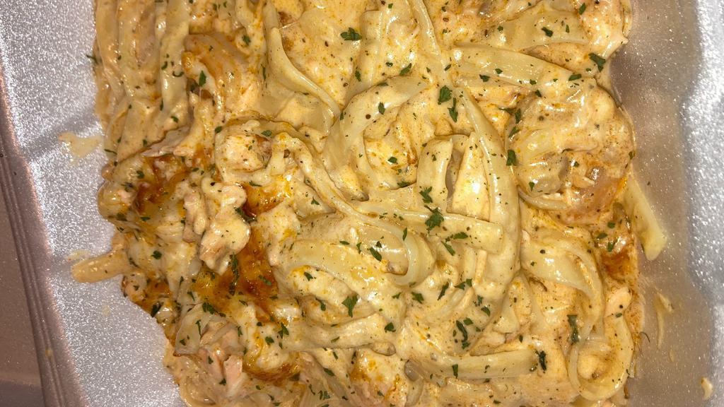 Surf & Turf Pasta · Homemade Baked Pasta made with a creamy cheese sauce, salmon, and shrimp.