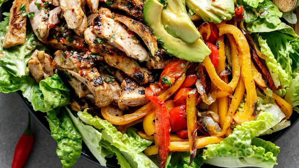Grilled Chili Lime Chicken Fajita Salad · Marinated chicken, avocado slices, grilled red and green peppers with a homemade chili lime dressing.