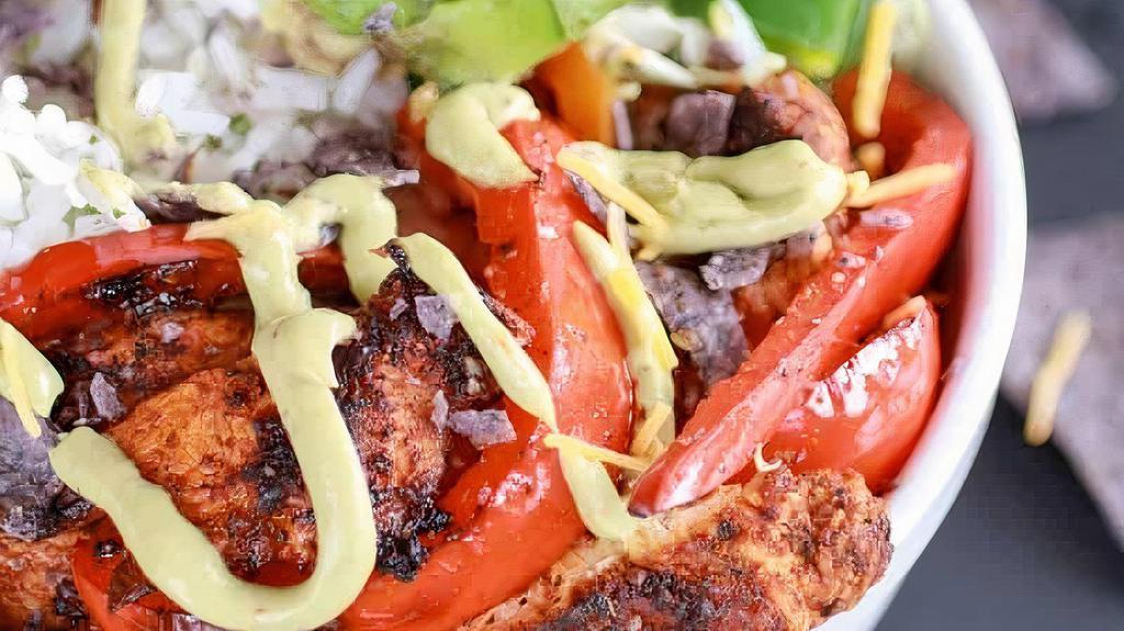 Grilled Chili Lime Chicken Fajita Bowl · Marinated chicken, avocado slices, grilled red and green peppers with a chili lime dressing over rice.