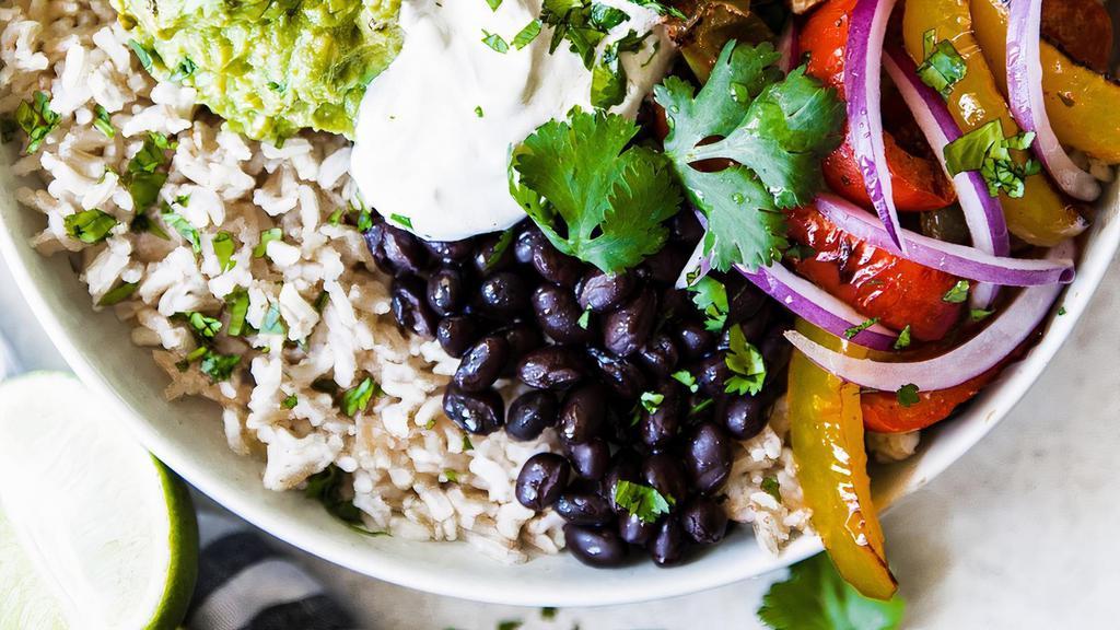 Fajita Chicken Burrito Bowl · Juicy chicken, grilled peppers and onions, cilantro lime rice, black beans, corn, diced red onions, lettuce, avocado, and a delicious dressing.