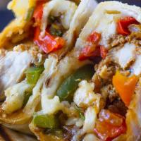 Chicken Fajita Wrap · Flour tortilla filled with Monterey jack and cheddar cheeses, grilled chipotle chicken, shre...
