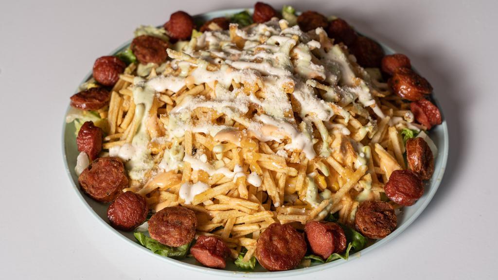 Mega Maicitos · Steak, chicken, sausage, Colombian sausage, chips, lettuce, Mozarella and Parmesan cheese.
