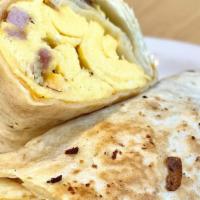 Breakfast Wrap · Two eggs scrambled with cheddar cheese all wrapped in a warm flour tortilla. Add choice of m...