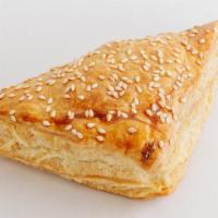 Chicken Empanada · Baked homemade pastry dough filled with chicken.