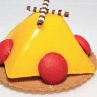 Passion Mousse · Passion mousse made with real passion fruit juice on an almond cookie.