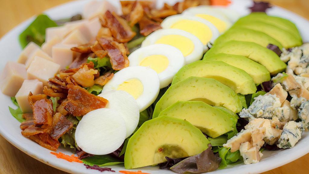 Cobb Salad · Mixed lettuce, blue cheese, bacon, grilled chicken, tomatoes, boiled eggs, and avocado..