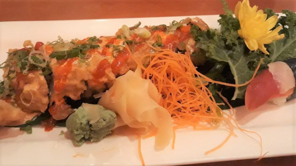 Diablo Roll · Tuna, salmon, yellow tail, crab fried stopped with fish egg scallions and spicy shrimp sauce.
