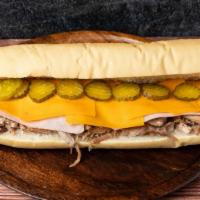 Sandwich Cubano · Cuban bread/ham / pork leg/yellow cheese / pickles/mustard.