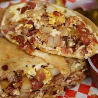 Breakfast Burrito · Scrambled eggs and cheese with breakfast potatoes/ Huevos revueltos con queso, con papas de ...