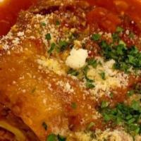 Lasagna Tradizionale · Homemade Lasagna Pasta, Layered with fresh Ricotta, Ground Meat and Oven Cooked in a 
Tomato...