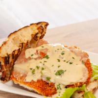 Chicken Milanese · Organic breaded chicken cutlet topped with Baby Arugula Salad, extra virgin olive oil finish...